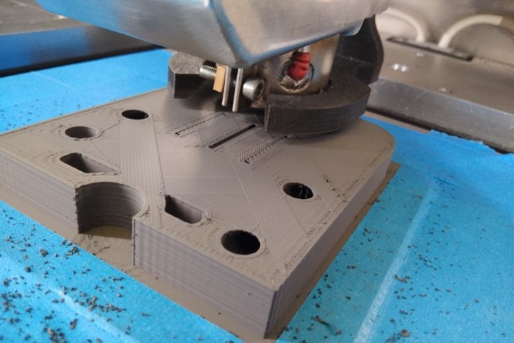 A 3D-printed tool for metal injection molding being produced on an ExAM 255.