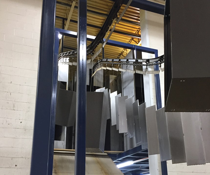 Affordable Interior System's parts run through an elevated conveyor line to save space.