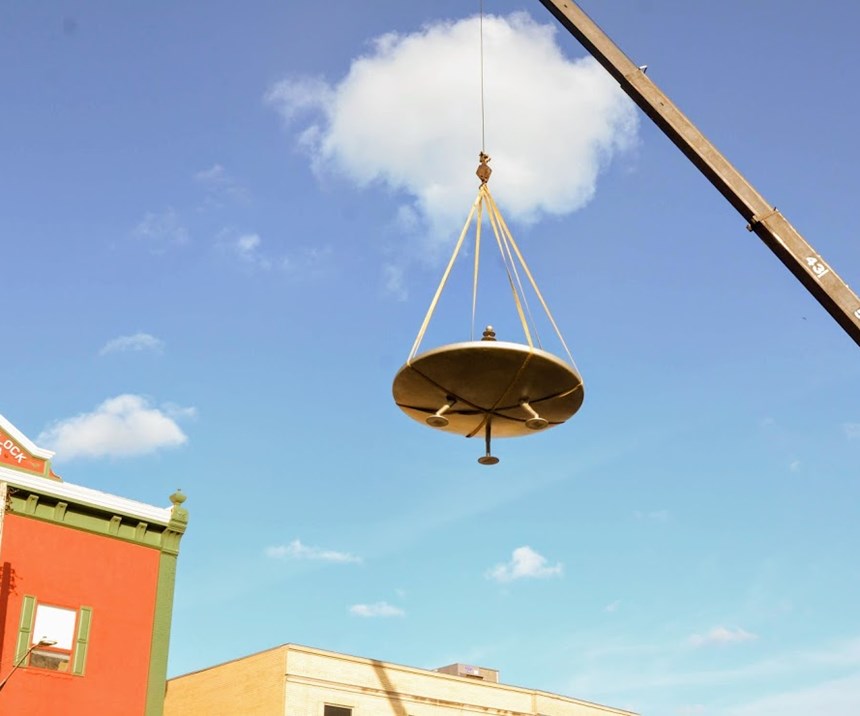 spaceship being hoisted by a crane