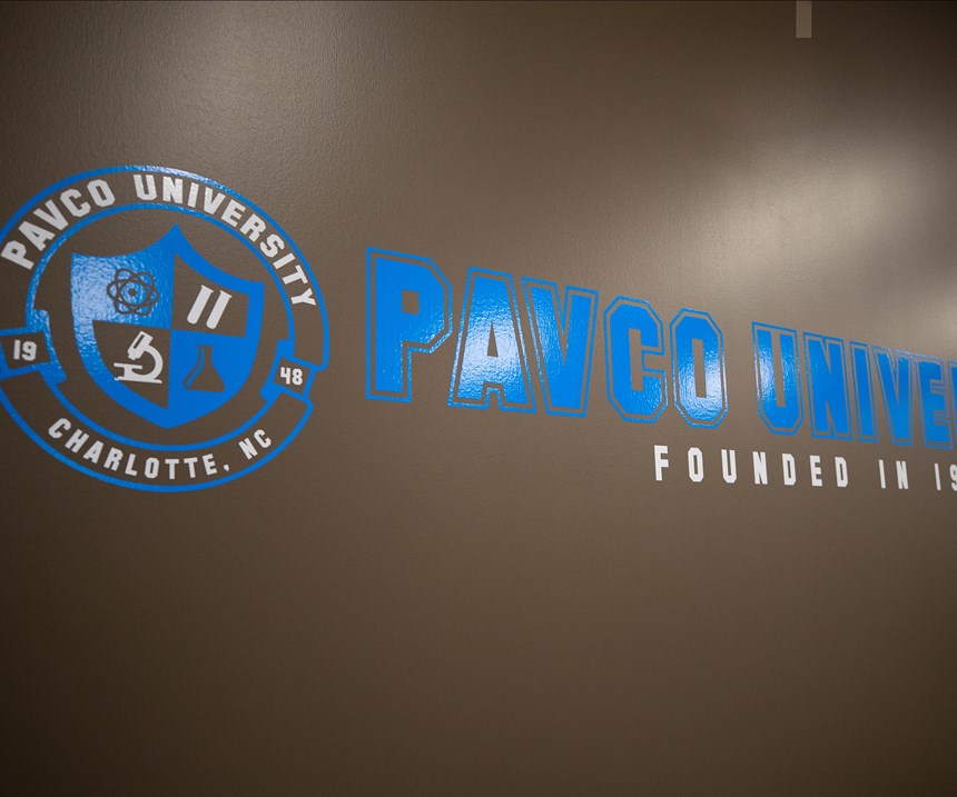 wall with lettering that says Pavco University