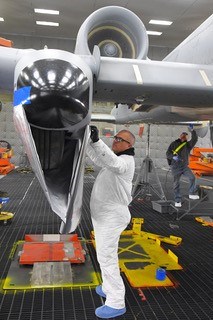 Corrosion-control technicians seal up the seams and holes in a first-production A-10’s outer surface skin to prevent blast media from entering the aircraft. (U.S. Air Force photo by Todd Cromar)