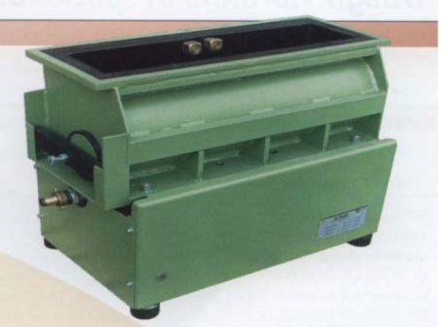 A traditional vibratory tub; ideal for processing long skinny parts such as splined-shafts, camshafts, crankshafts, pinion shafts, spars, etc.