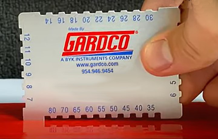 a photo of the gardco calling card and wet film thickness gauge
