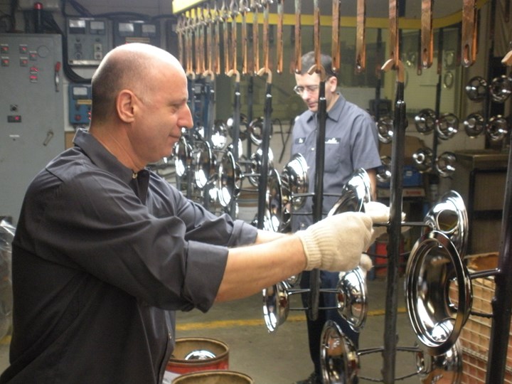 two Microfinish workers completing a finishing process