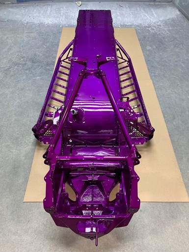 snowmobile chassis with purple coating