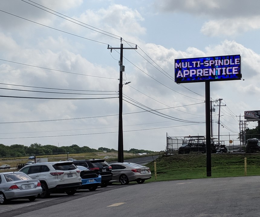 "Multi-Spindle Apprentice" billboard outside Cox Manufacturing