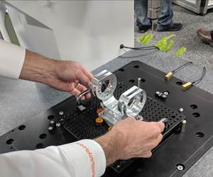 A Mitutoyo employee shows how to quickly switch the fixturing on the MiSTAR 555 CMM