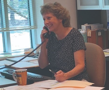 Renee Merker working the phones, planning a valuable and fun Annual Meeting being held at the Big Cedar Lodge in Branson, Missouri,  in October. 