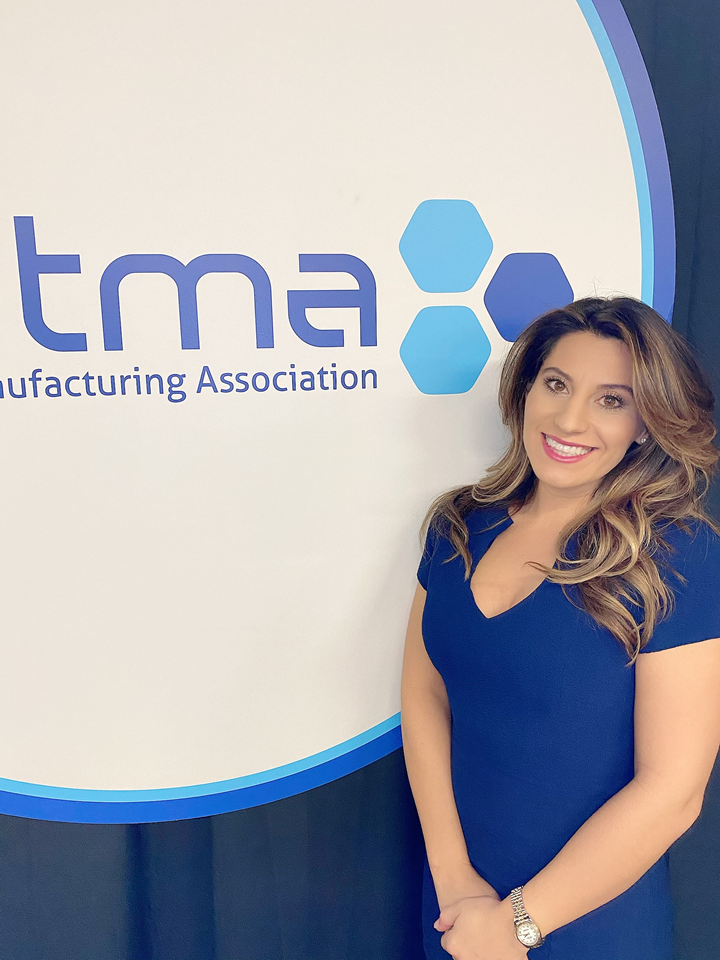 Nicole Wolter next to TMA sign