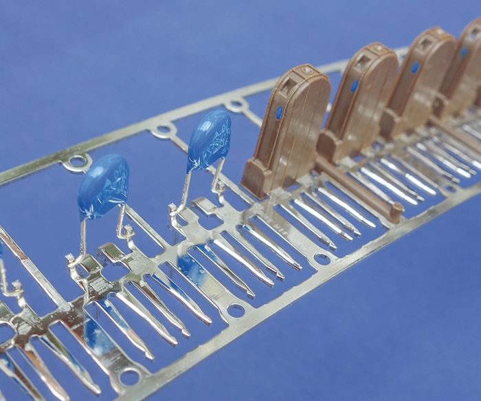 Engel supplies linear cell systems for overmolding plastic onto a metal striip  to produce electronic components.