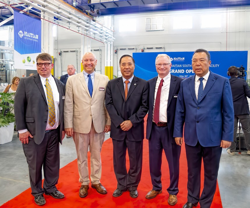 The plant opening was attended by Zhang Jianming, Haitian Group CEO (center); Zhang Jianfeng, CEO of Haitian Plastics Machinery (right); and Absolute Haitian co-owners (l.-r.) Glenn Frohring, Nathan Smith, and Mike Ortolano.