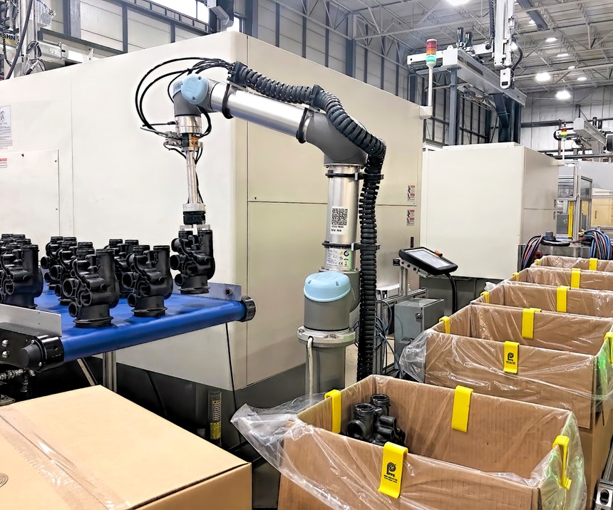 As shown here, cobots often don’t need guarding to perform tasks like removing parts from a conveyor and packing them in boxes.