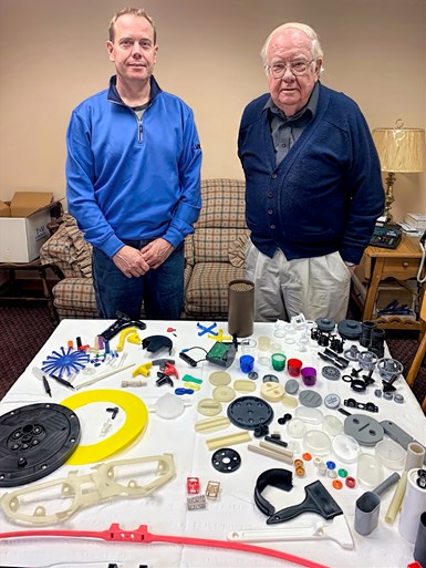 Tom and T.R. Paquin with samples of their production.