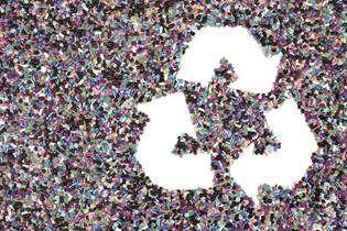recycling symbol made from post-consumer recycled plastic pellets