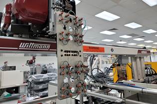 Wittmann robot running in an injection molding facility