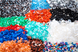 ground plastic in piles, each pile in a different color