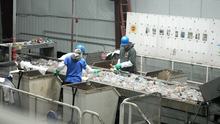Placon workers sort plastic. 