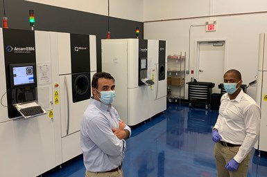 Amplify Additive today has three GE Arcam electron beam melting (EBM) machines in its Maine facility, but the facility is ready for seven more. Seen here: founder Brian McLaughlin (left) and senior AM applications engineer Jonathan Buckley.