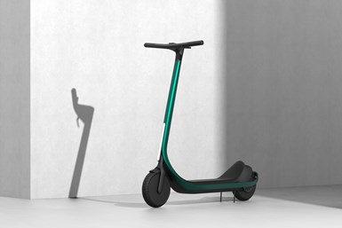 A photo of the Scotsman scooter in front of an off-white wall.