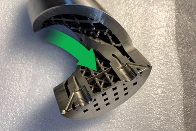 metal 3D printed component cut open to reveal unexpected feature inside
