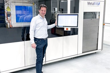 Egon Seegers, ABB Turbocharging general manager of service parts, with a MetalFAB1. Photo Credit: Additive Industries.