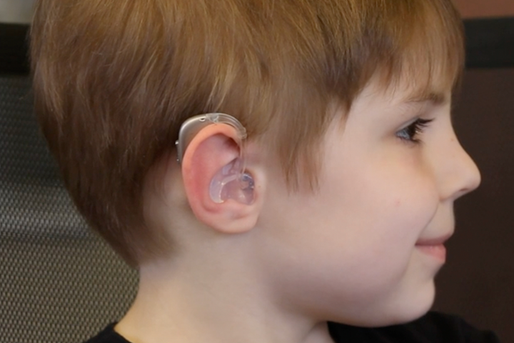child wearing a hearing aid 
