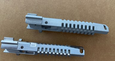 3D printed firearm component and a piece later produced through MIM
