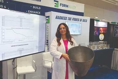 Melanie Lang, co-founder/CEO of FormAlloy, holds a 3D printed Rocket Nozzle made of a nickel-based superalloy (Inconel625) from FormAlloy’s directed energy deposition system.