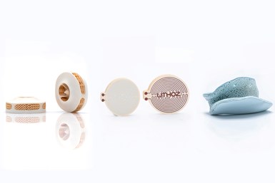 Display of multimaterial parts (left to right): ceramic and polymer; pure copper and glass ceramic; hydroxy apatite and tricalcium phosphate.Photo Credit: INKplant