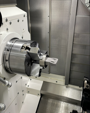 additive part held via puck clamping surface in cnc lathe