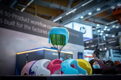 Colorful finished cranial helmets produced with HP MJF technology at Formnext 2023. Source: DyeMansion