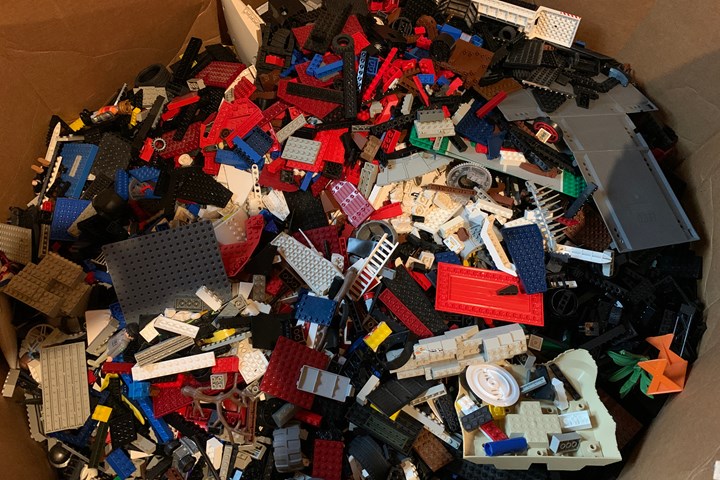 Thousands of LEGOs in a large box.