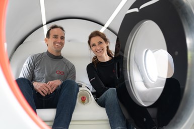 Josh Giegel, Co-Founder and Chief Technology Officer, and Sara Luchian, Director of Passenger Experience safely ride in the hyperloop pod.