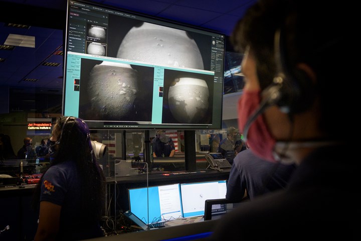 NASA rover team watch in mission control as first landing images arrive.