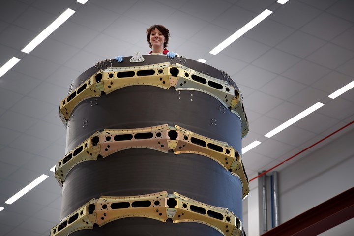 Swedish space minister Matilda Ernkrans goes on top of a RUAG Space dispenser in Linköping.
