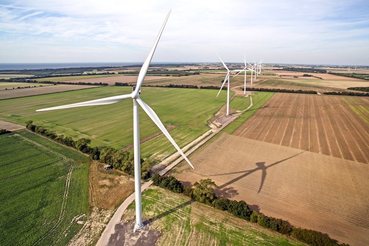 A wind turbine on a farm.