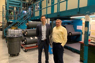 AvCarb Guy Ebbrell and Roger Masse in front of coating line