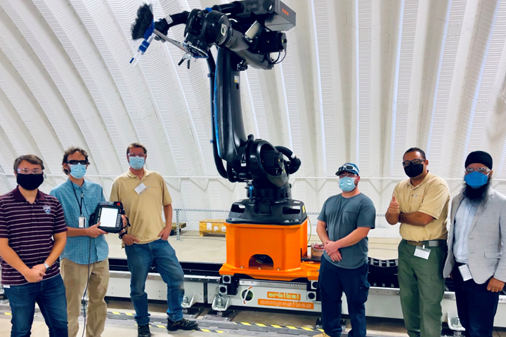Orbital Composites and NREL team with installed robotic system.