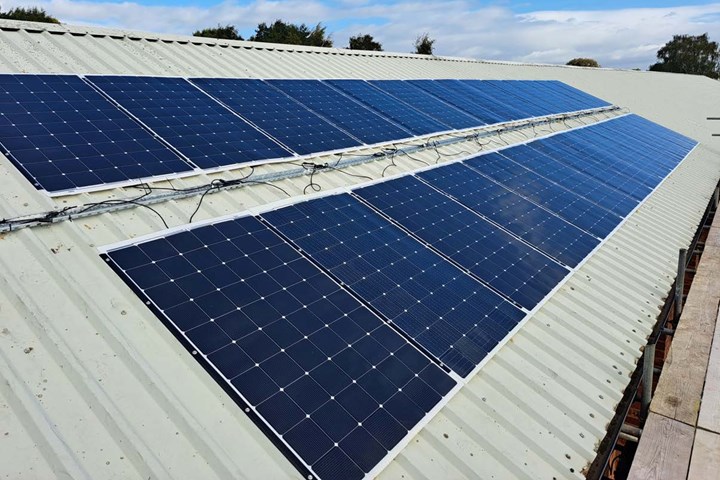 Solar panels bonded to roofing structure.