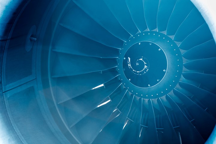 Close up of a big jet engine with blue light leak.