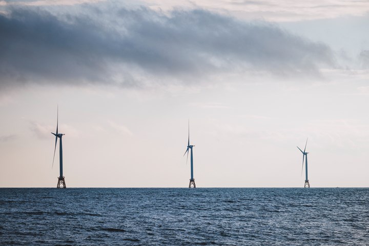 Three wind turbines out to sea for renewable energy in New Shoreham, Rhode Island,.