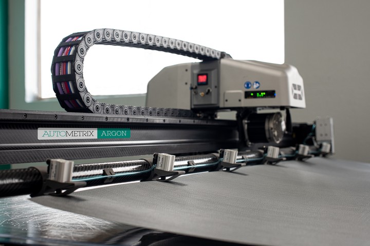 Autostore Gripper Gripper attachment precisely handles rolled materials | CompositesWorld