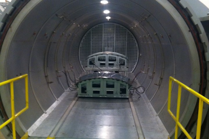 An autoclave with a part inside.