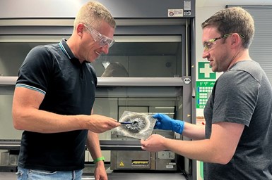 Experts from Envalior inspect a Tepex test specimen that successfully withstood a battery stress test.