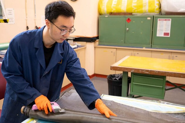 UNSW Canberra researcher Di He with a sample of carbon fiber recycled using a method he developed.