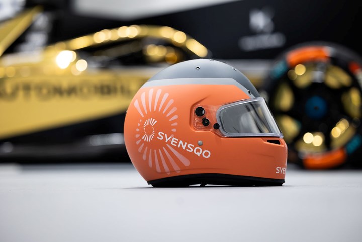Formula E helmet with Syensqo logo on side.