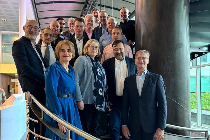 Tech-Fab Europe and EuCIA members on a set of stairs.