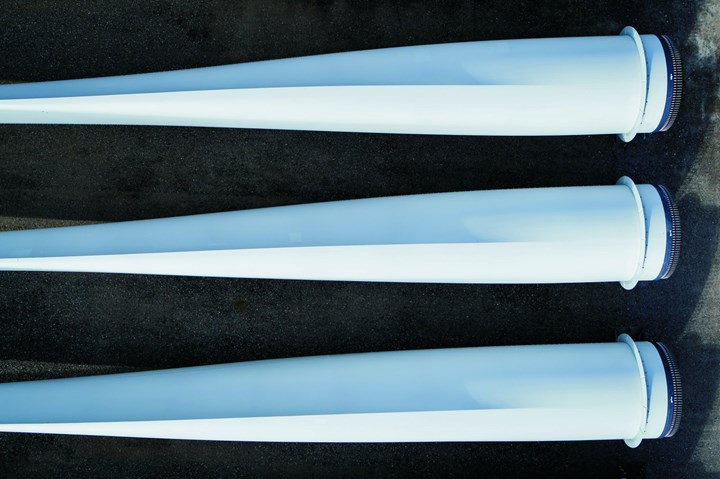 Aerial view of three wind blades.