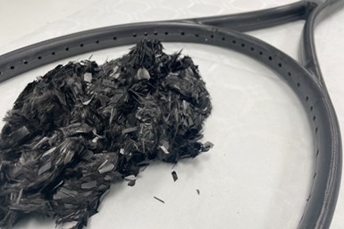 tennis racket made from realigned recycled carbon fibers