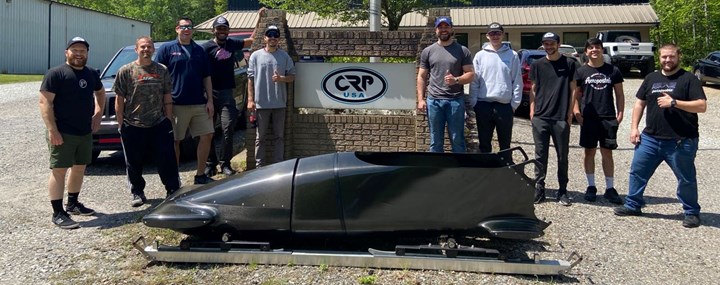USABS team with CRP USA in front of bobsled.